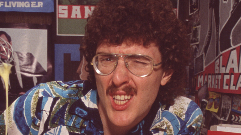 Weird Al Yankovic grimaces in a photo shoot in the 1980s.