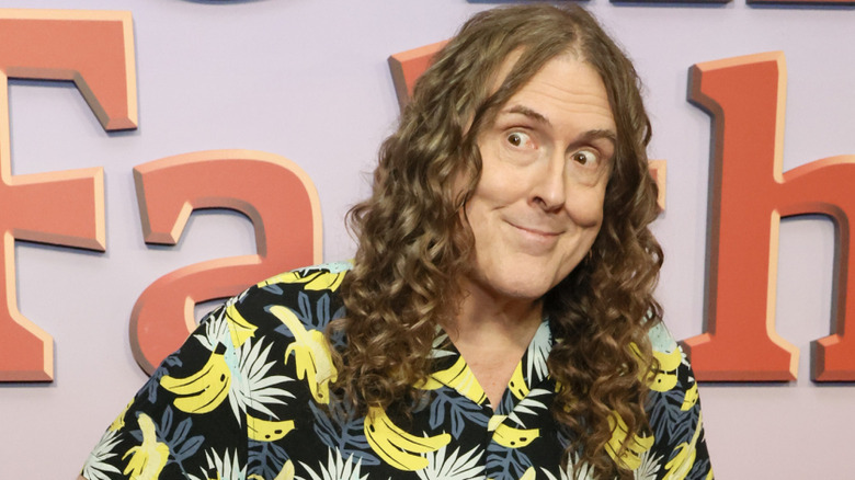 Weird Al Yankovic looks to the side at the premiere of The Simpsons Christmas Special.