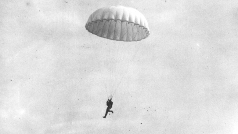 man falling with parachute