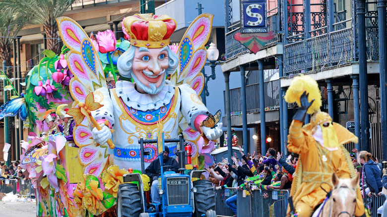 A Mardi Gras parade with a float