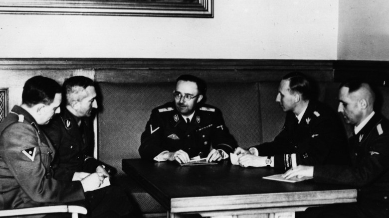 Eichmann, Muller, Heydrich sit at table