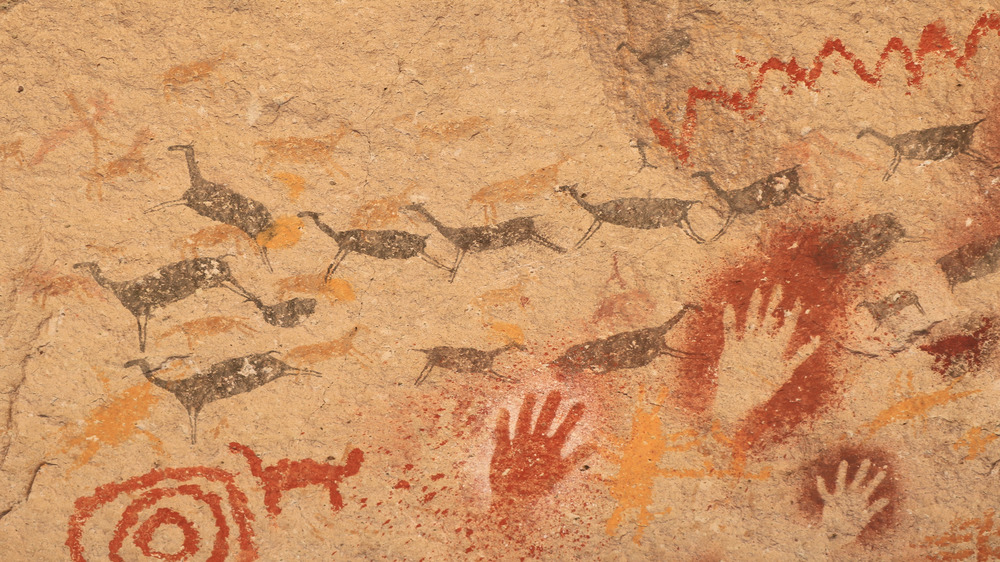 An ancient cave painting showing a pack of gazelles