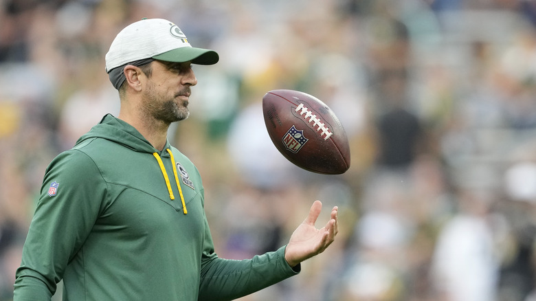 Aaron Rodgers shows off a Nicolas Cage bust in his Packers locker