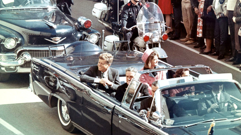 John F. Kennedy riding in motorcade before his assassination