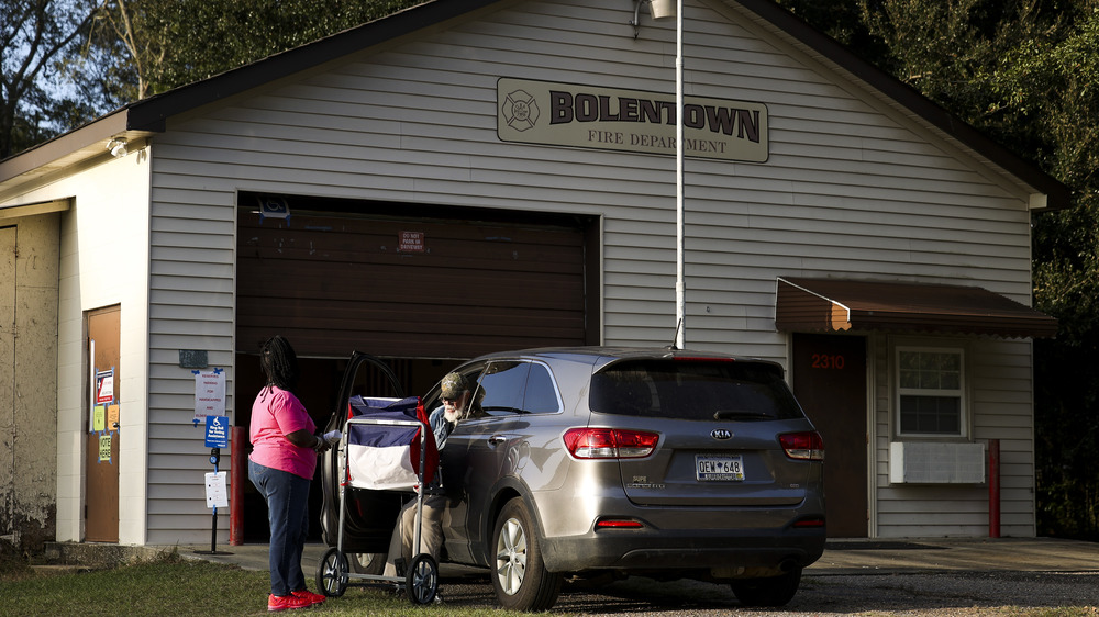 Voting at a makeshift voting booth at a California Fire Department 