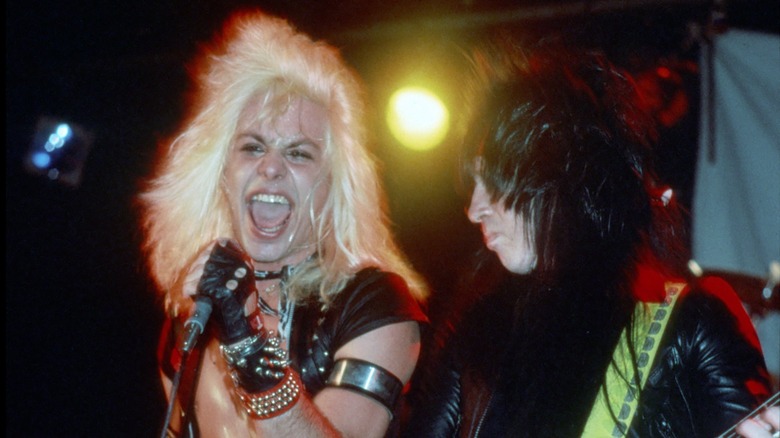 Vince Neil and Mick Mars performing live