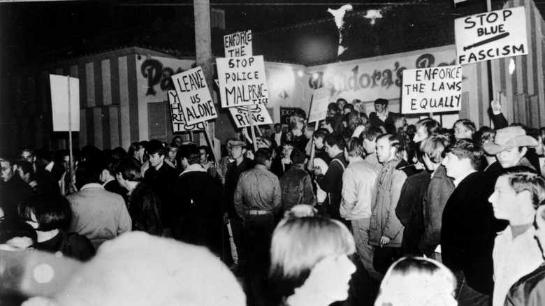 Crowd protesting holding placards