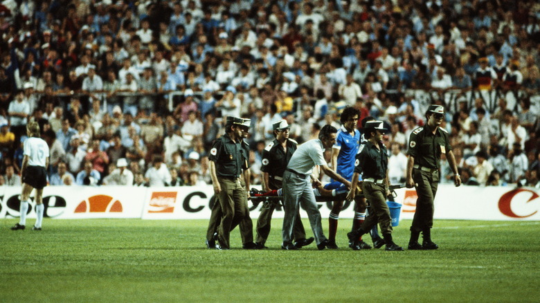 Patrick Battiston carried off the pitch at the World Cup