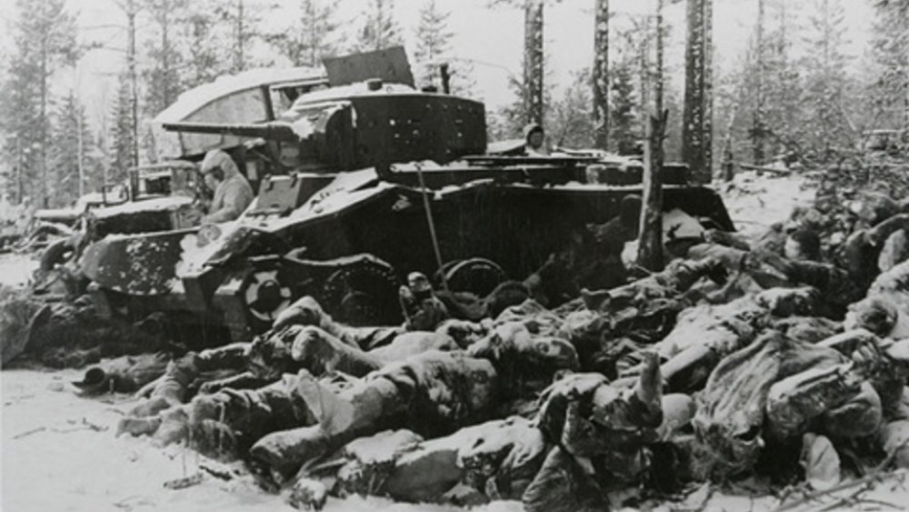 A declassified photo from the Winter War showing a tank and the dead
