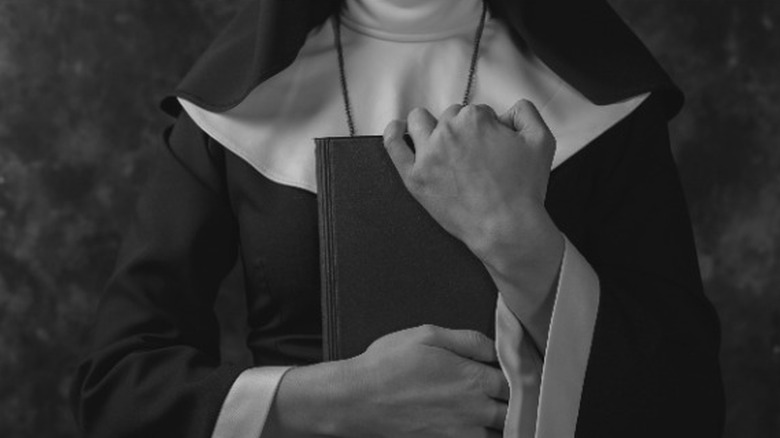 Nun with Bible