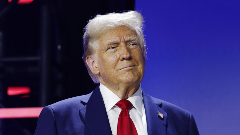 Donald Trump in blue suit and red tie