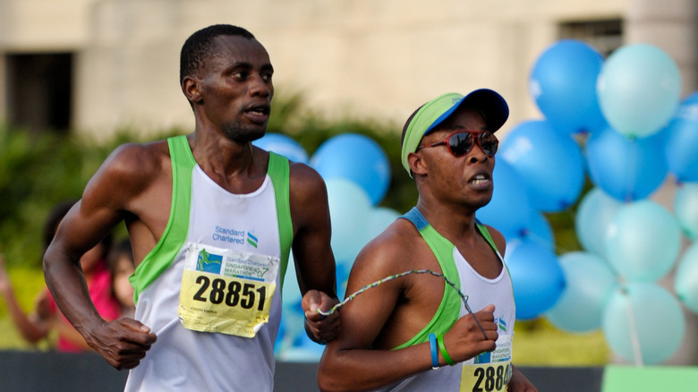 Henry Wanyoike with his running guide