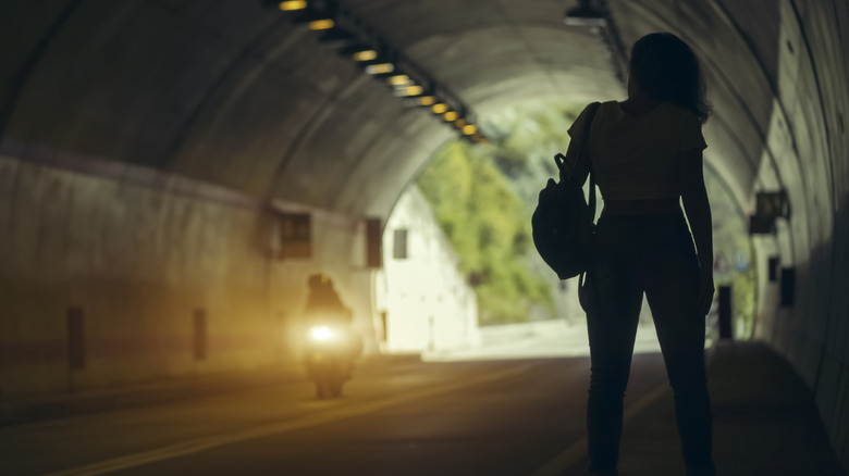 Photo of hitchhiker in tunnel