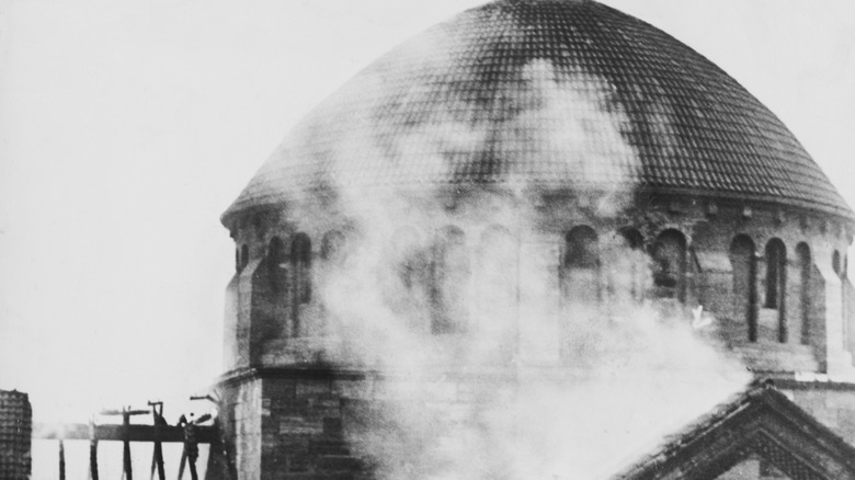 A burning synagogue during Kristallnacht