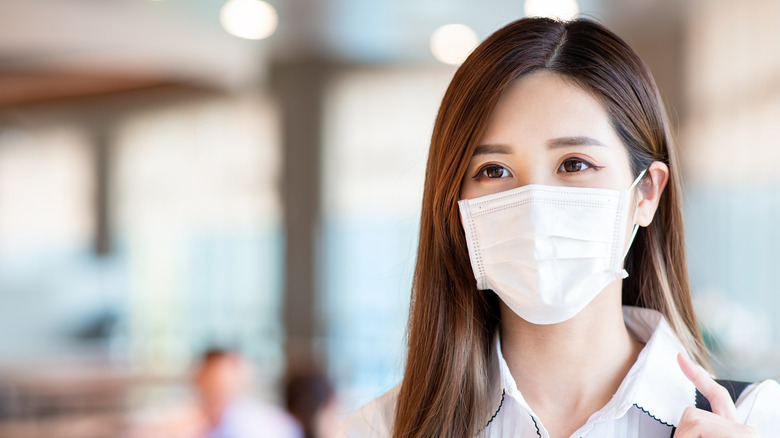 A Korean woman with a mask