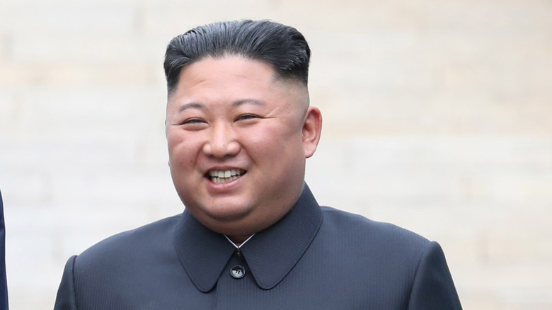 a smiling Kim Jong-un