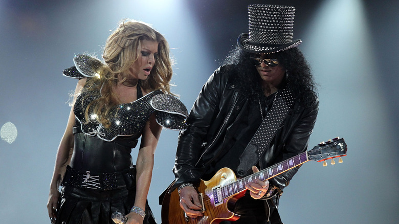 Fergie and Slash performing on stage at the 2011 Super Bowl