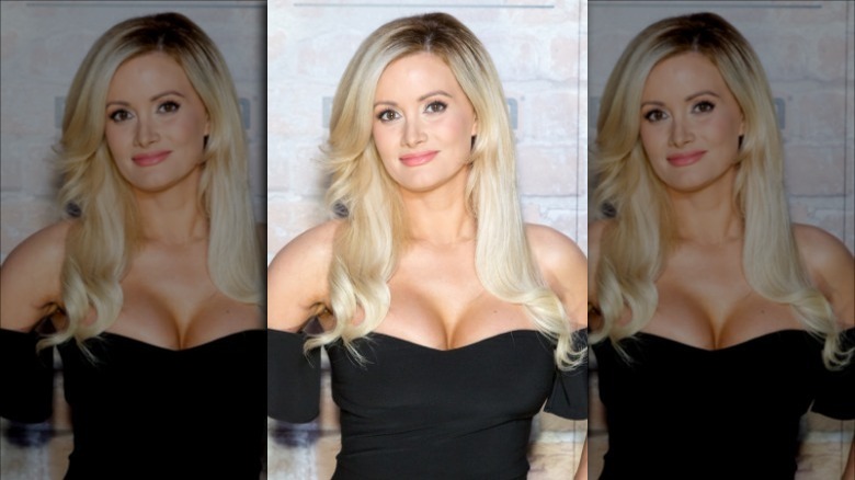 Former Playmate Holly Madison posing for a photo