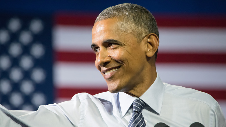 Barck Obama grinning with American flag