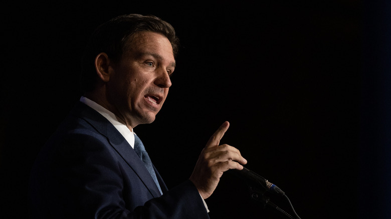 Ron DeSantis gesturing while speaking onstage