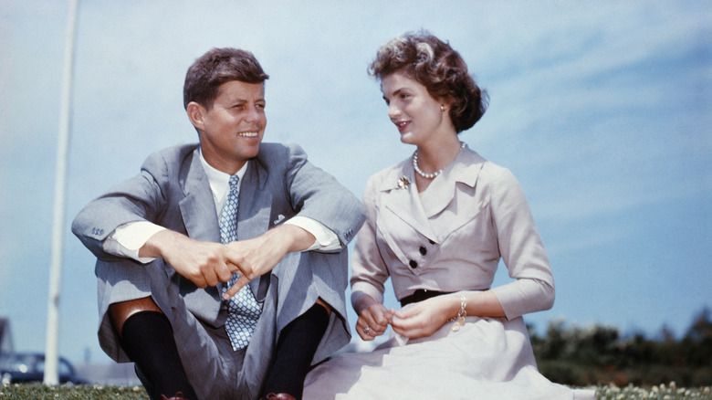 JFK sitting with Jackie Kennedy