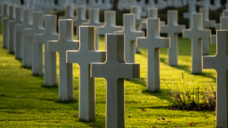 wwii cemetery white crosses green grass