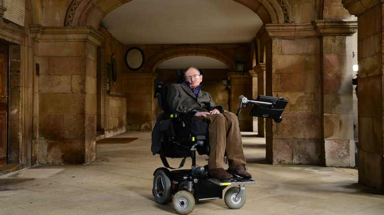 Stephen Hawking under stone archway at Cambridge University