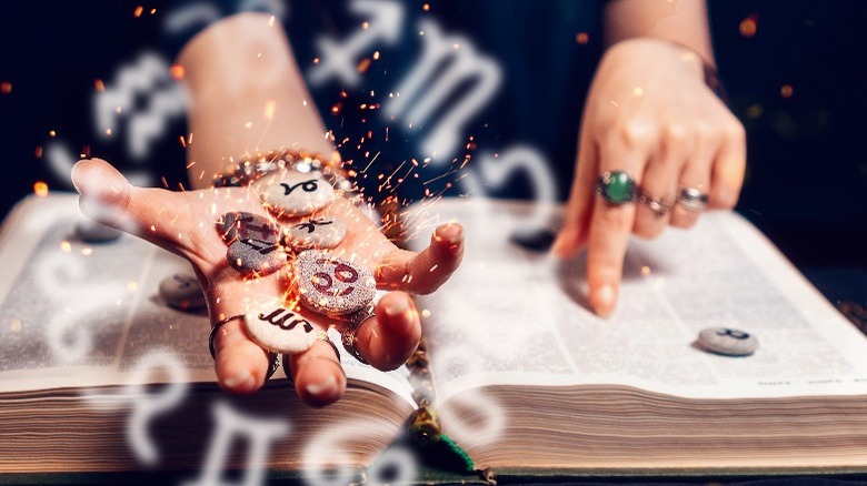 Fortune teller holding stones