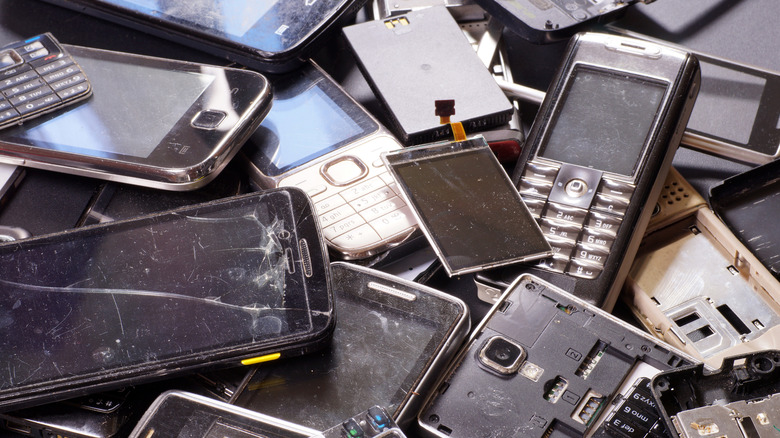 Pile of broken cell phones