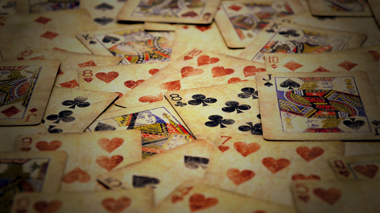 Vintage playing cards scattered