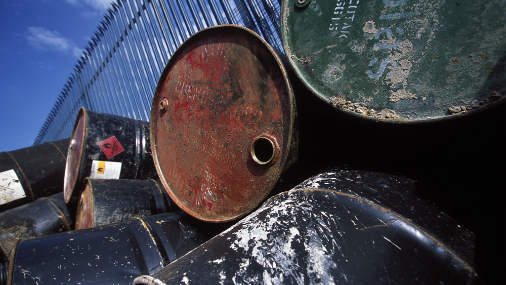 Pile of used steel barrels