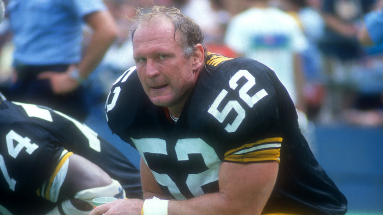Mike Webster sitting on bench