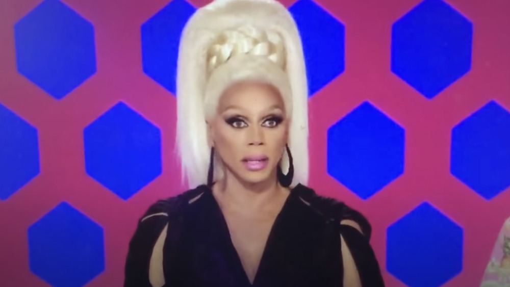 Ru Paul Charles wearing tall blonde wig