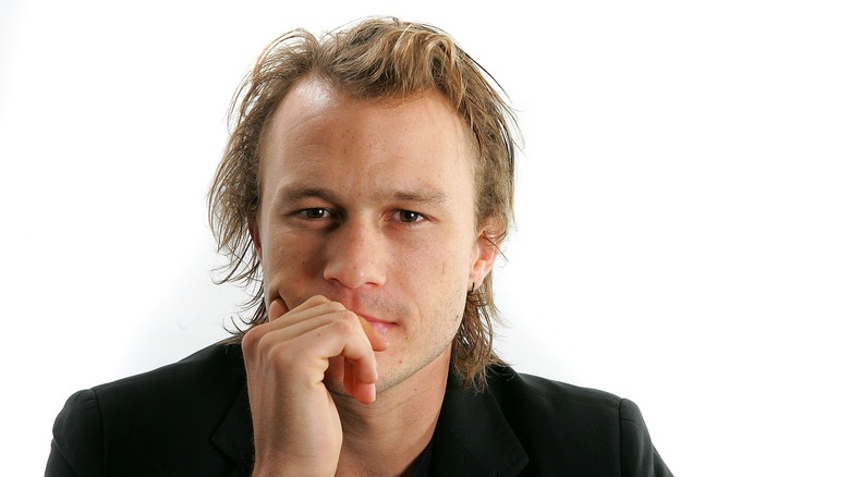 Heath Ledger with hand to face