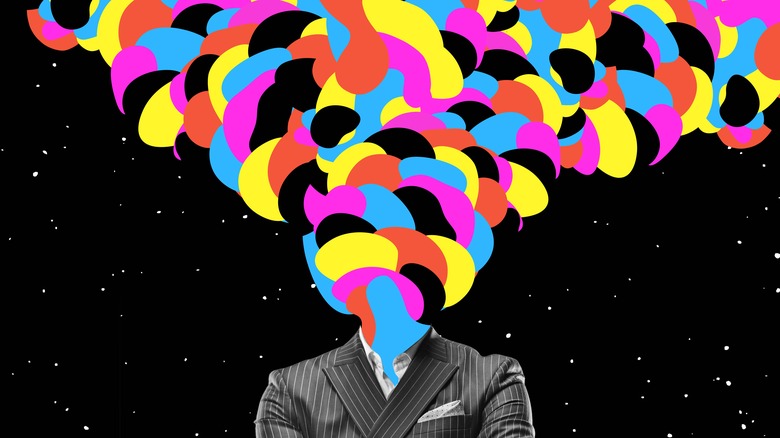 Decapitated businessman spewing color blobs