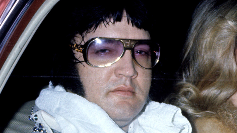 Elvis wearing his signature sunglasses in the 1970s