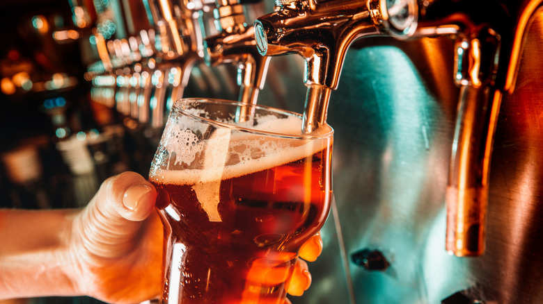 Bartender pours beer