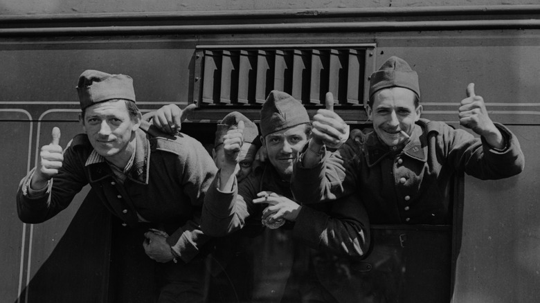 French troops give the thumbs up