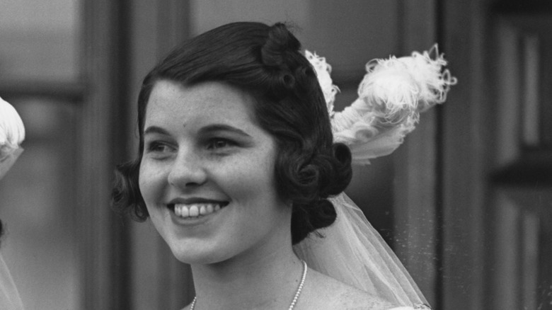 Rosemary Kennedy smiling feather in hair