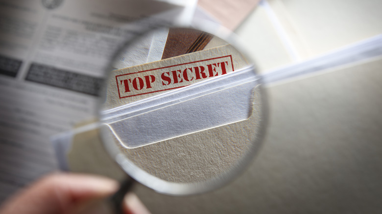 Magnifying glass over the words top secret