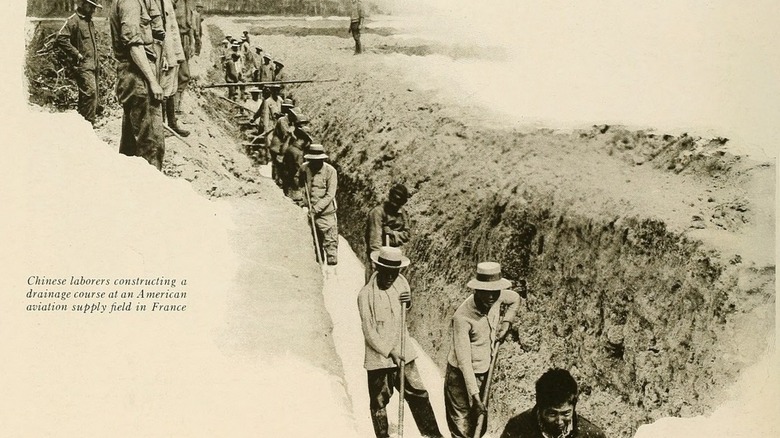 Chinese laborers constructing a drainage at an American aviation supply field in France