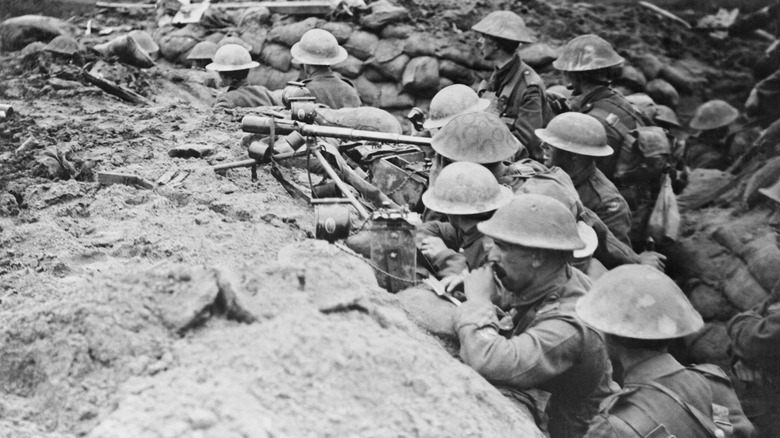 Large group of British soldiers standing in World War I trench