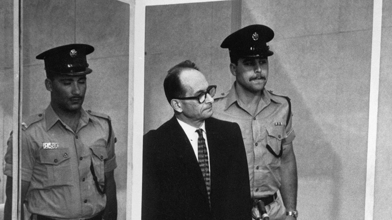 adolf eichmann stands during 1961 trial