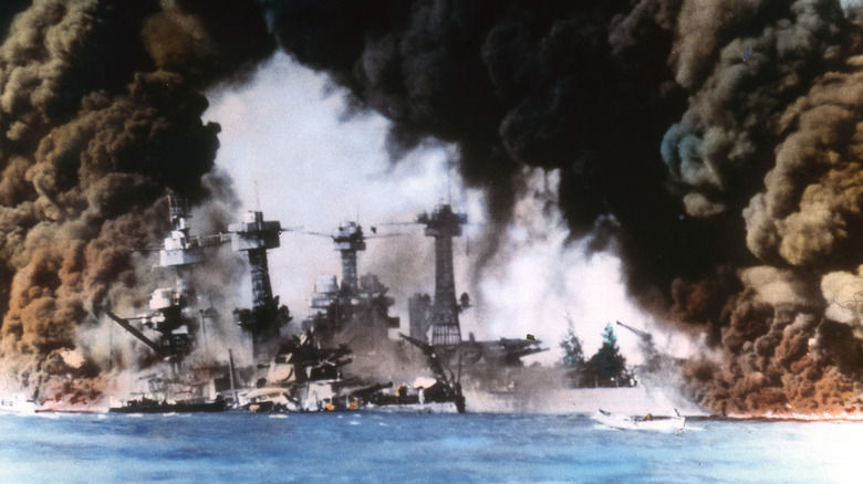 colorized battleships in pearl harbor mid-attack