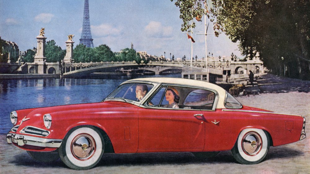 Couple driving a car in the 1950s 