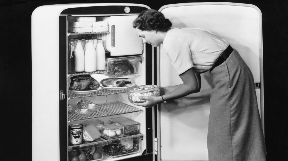 1950s woman using the fridge