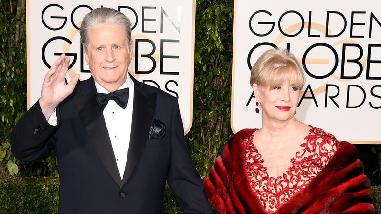 Brian Wilson and Melinda Ledbetter walking a Golden Globes red carpet