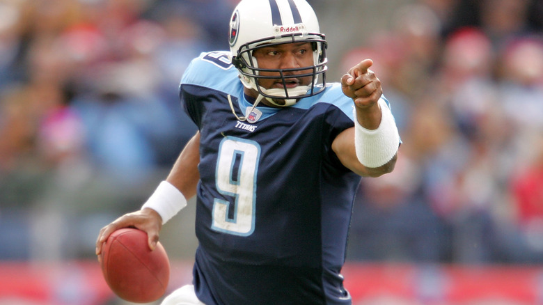 Steve McNair holding ball pointing finger Tennessee Titans
