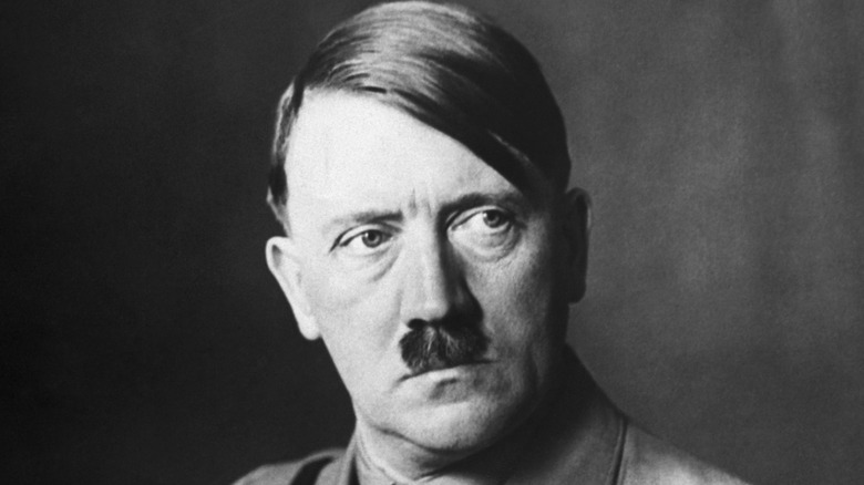 Adolf Hitler sitting for a portrait and looking to the side