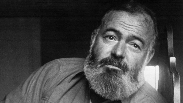 Bearded Ernest Hemingway looking into the distance